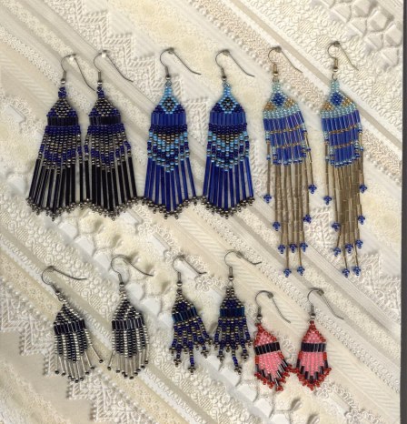 Hand-beaded using 11/0 seed beads and various size bugle beads. Various colors, styles and lengths. The blue and gold pr. top right, are my own design. 